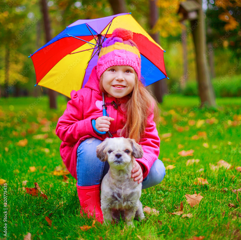 girl with her dog in the autumn park girl with her dog in the autumn park
