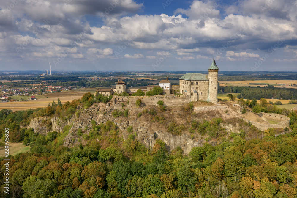 Aerial photo of beautiful medieval castle Kunětická hora near city of Pardubice in the heart of Czech Republic on the top of the hill in surrouding lowlands and villages nearby from ultralight plane
