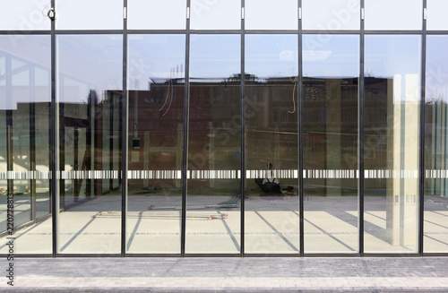 New glass windows  with reflectionsin the new city office building. photo