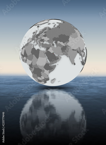 Kuwait on globe above water