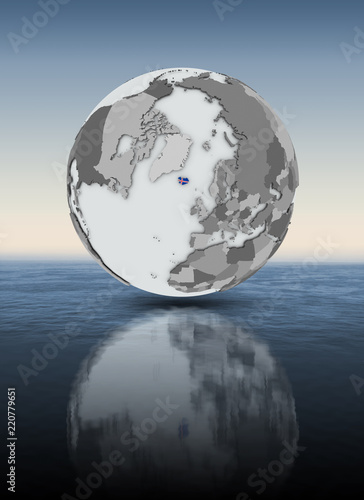 Iceland on globe above water