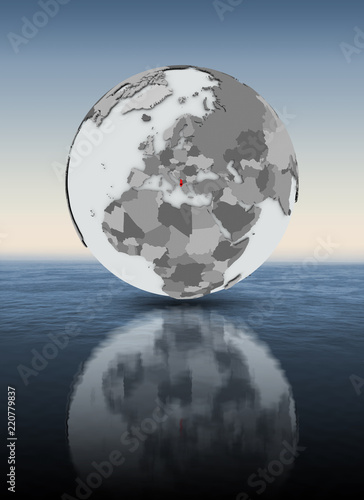 Albania on globe above water