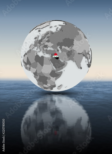Iraq on globe above water