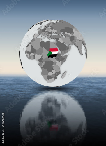 Sudan on globe above water