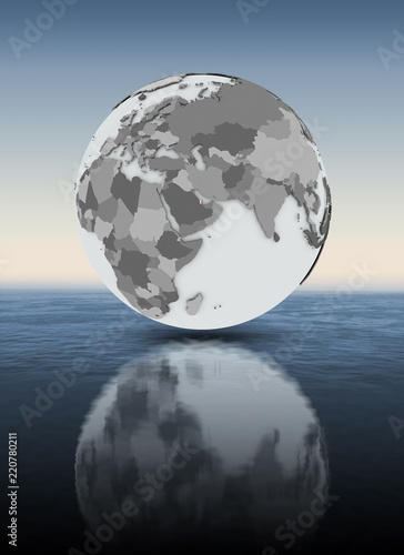 Qatar on globe above water