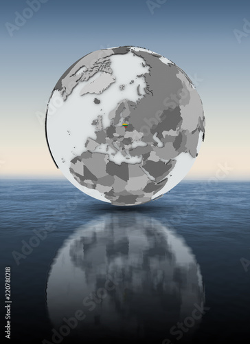 Lithuania on globe above water