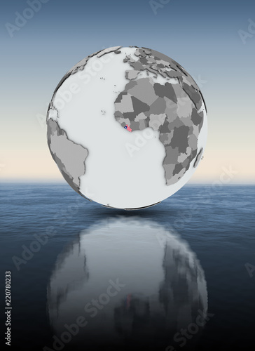 Liberia on globe above water