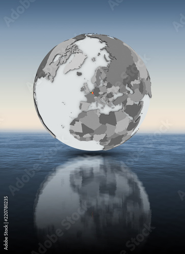 Belgium on globe above water