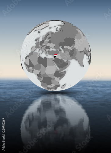 Syria on globe above water