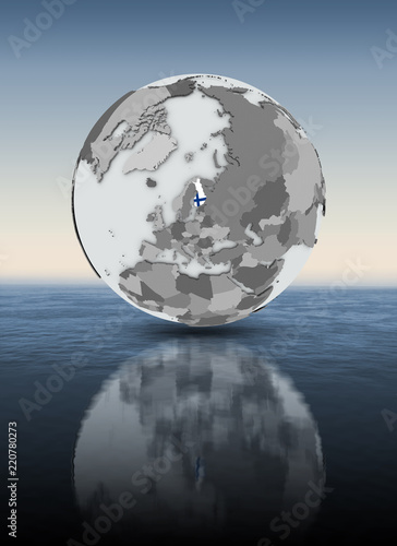 Finland on globe above water