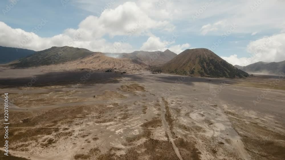Mountain Bromo active volcano crater in East Jawa, Indonesia. Aerial view of volcano crater Mount Gunung Bromo is an active volcano,Tengger Semeru National Park. 4K video. Aerial footage.