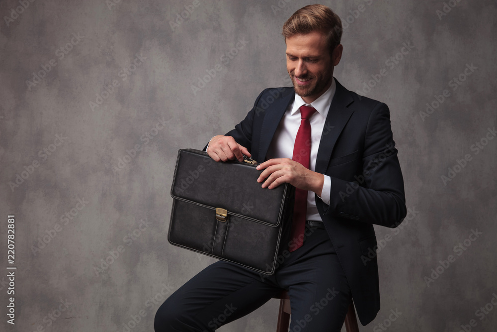 happy confident businessman holding briefcase is ready for his interview happy confident businessman holding briefcase is ready for his interview