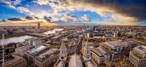 London, England - Aerial panoramic skyline view of London taken from top of St.Paul's Cathedral with dramatic clouds at sunset photo