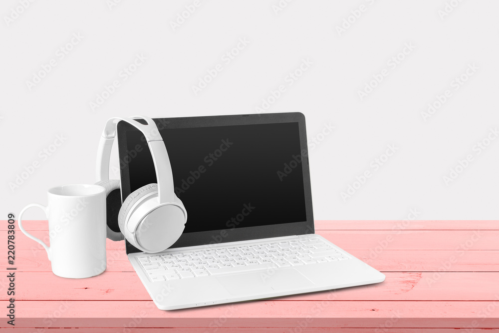 New headphones and laptop on the table New headphones and laptop on the table
