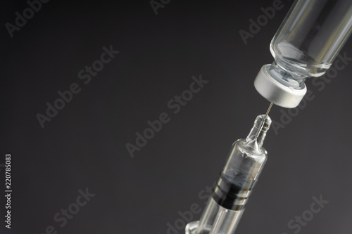 Syringe and vials closeup with selective focus and crop fragment. Medical and Healthcare Concept