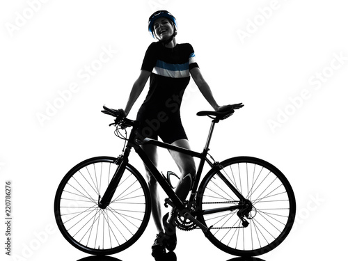 Fototapeta Naklejka Na Ścianę i Meble -  one caucasian cyclist woman cycling riding bicycle in silhouette isolated on white background