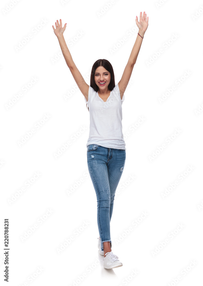 beautiful brunette woman in white t-shirt stepping and celebrating beautiful brunette woman in white t-shirt stepping and celebrating
