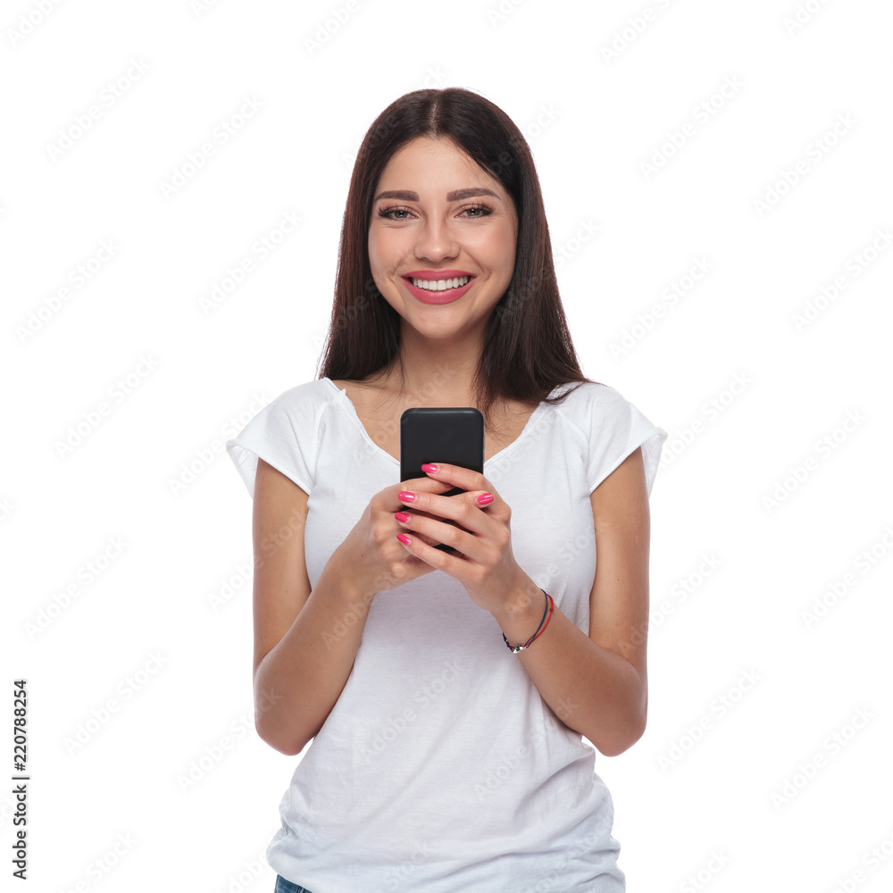 portrait of beautiful smiling woman texting on mobile phone portrait of beautiful smiling woman texting on mobile phone