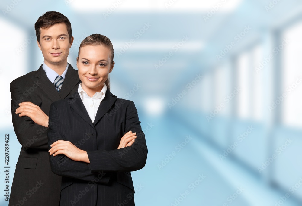 Confident young Business couple with crossed hands on background Confident young Business couple with crossed hands on background
