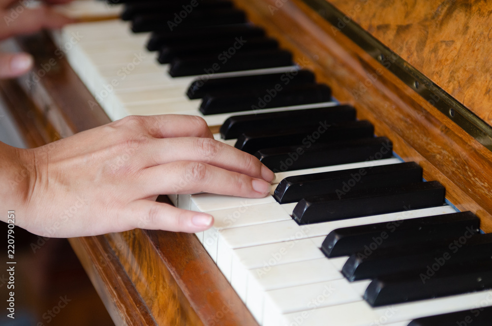 close up shot, hand of musician playing piano