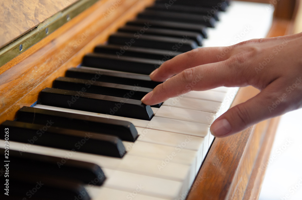 close up shot, hand of musician playing piano