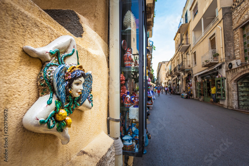 TAORMINA, ITALY - OCTOBER 16, 2014: Typical Sicilian Souvenir in ceramic symbolising the sunshine and triskelions - symbol of Sicily