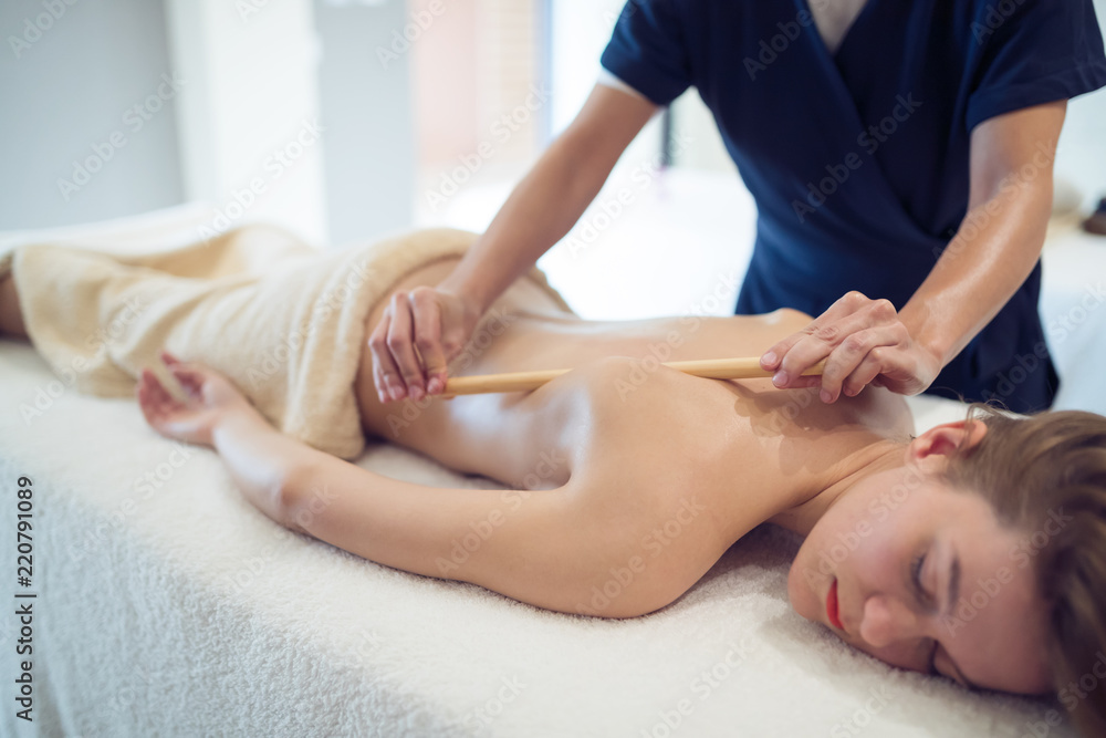 Thai massage therapist treating patient Thai massage therapist treating patient