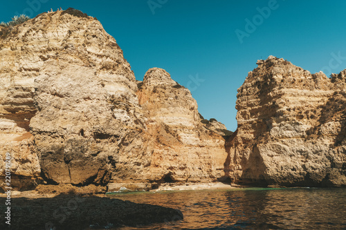 Rocks, Cliffs And Ocean Landscape At Lagos Bay Coast In Algarve, Portugal
