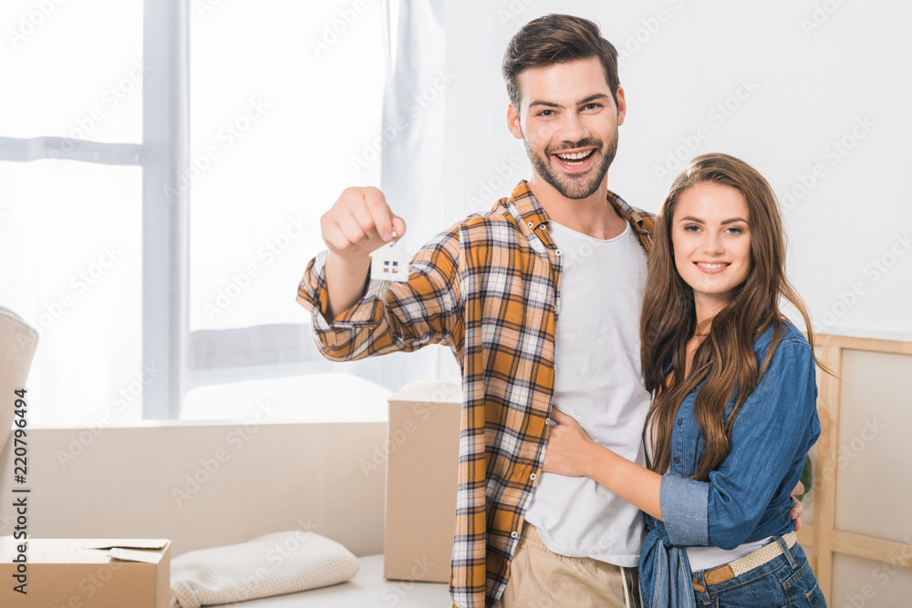 selective focus of happy couple with keys from new home selective focus of happy couple with keys from new home