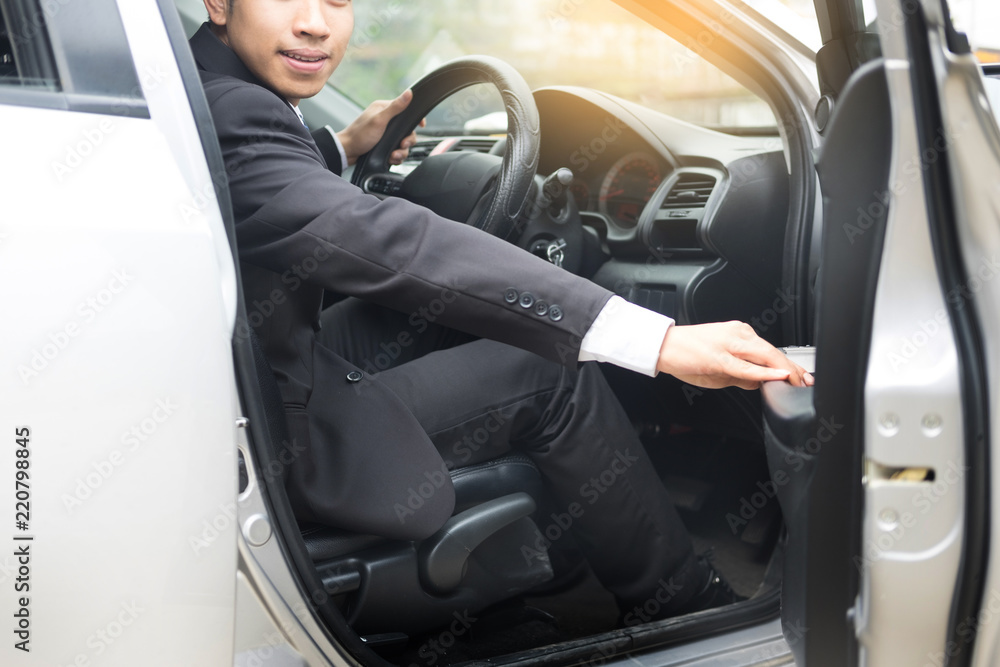 Portrait of a young handsome businessman driving a luxury sports car (rich) Portrait of a young handsome businessman driving a luxury sports car (rich)