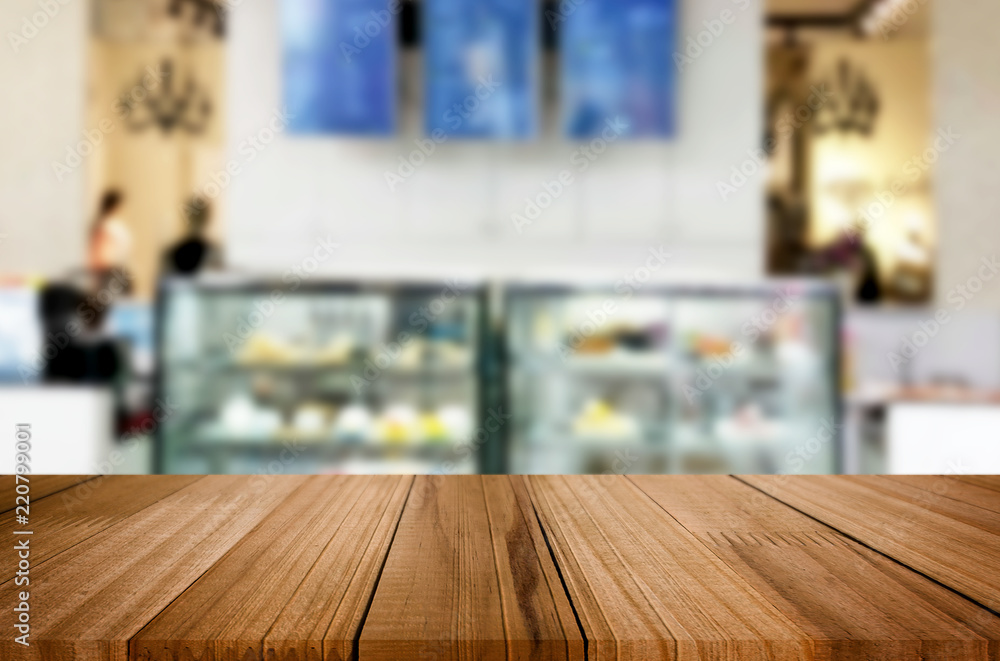 Selected focus empty brown wooden table and Coffee shop or restaurent blur background with bokeh image. for your photomontage or product display Selected focus empty brown wooden table and Coffee shop or restaurent blur background with bokeh image. for your photomontage or product display