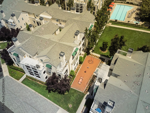 Aerial view typical multi-level apartment homes with swimming pool in Silicon Valley, California photo