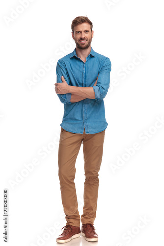 confident smiling casual man with hands crossed