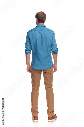 back view of a casual man standing