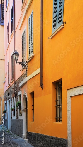 Fototapeta Naklejka Na Ścianę i Meble -  Medieval halley with orange and pink facades. Brescia, Italy.