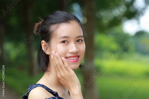 Wallpaper Mural the face of woman in green back ground Torontodigital.ca