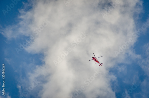 Rescue chopper at   the Horn  Matterhorn  with a good cloud effects on the background