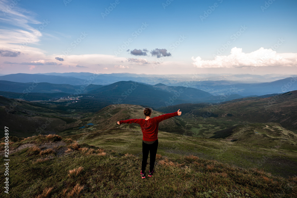 Active hiker enjoying the view. Carpathians, Ukraine Active hiker enjoying the view. Carpathians, Ukraine