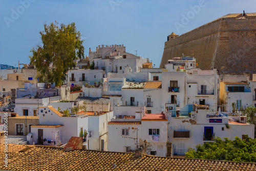 view of old Ibiza with typical white houses and restaurants /view of old Ibiza with typical white houses and restaurants  near the bulwark of Santa Lucia photo