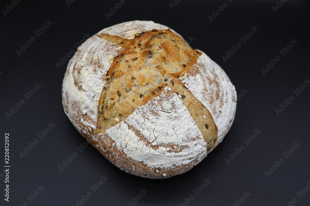 Fresh bread with seasonings on a dark background Fresh bread with seasonings on a dark background