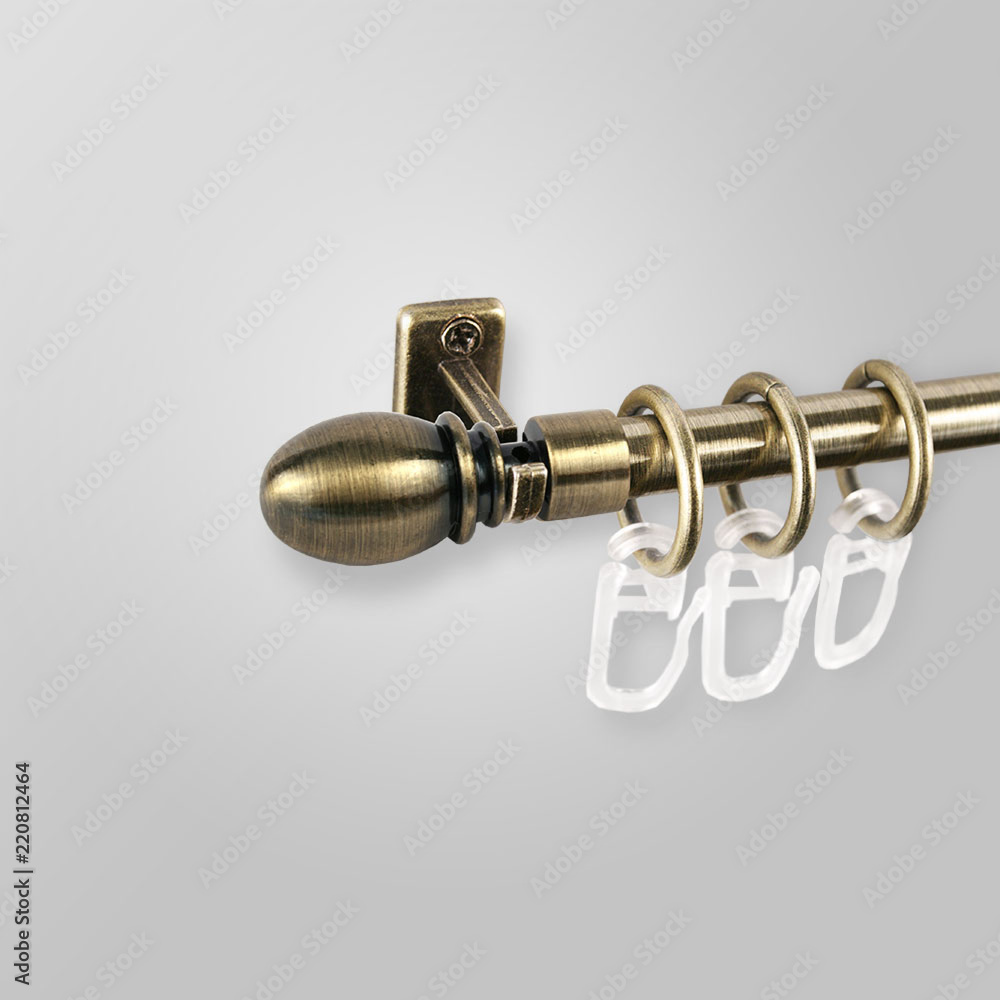 Metal curtain cornice and finials on the gray background. Metal ending for cornices. Metal curtain cornice and finials on the gray background. Metal ending for cornices.
