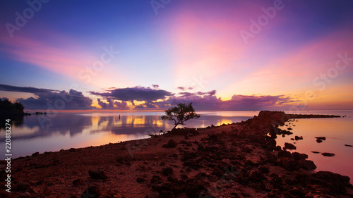 Sunrise over North Cebu Province Fisherman fishing in the Sea with a fishing rod