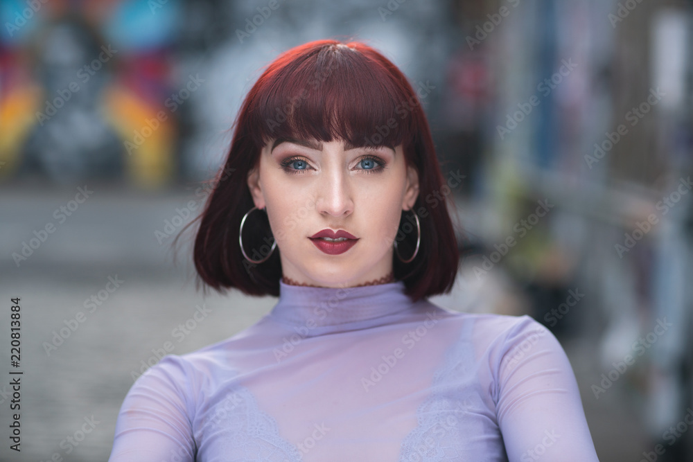 Obraz premium Portrait of young redhead with purple turtle neck