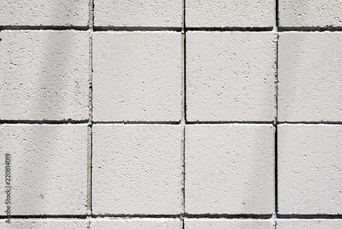 A view of a white concrete wall in geometric pattern for background or wallpaper use
