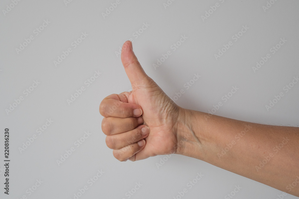 female hand with thumbs up
