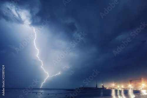 Summer storm, dramatic sky and amazing lightnings over the ocean. natural background