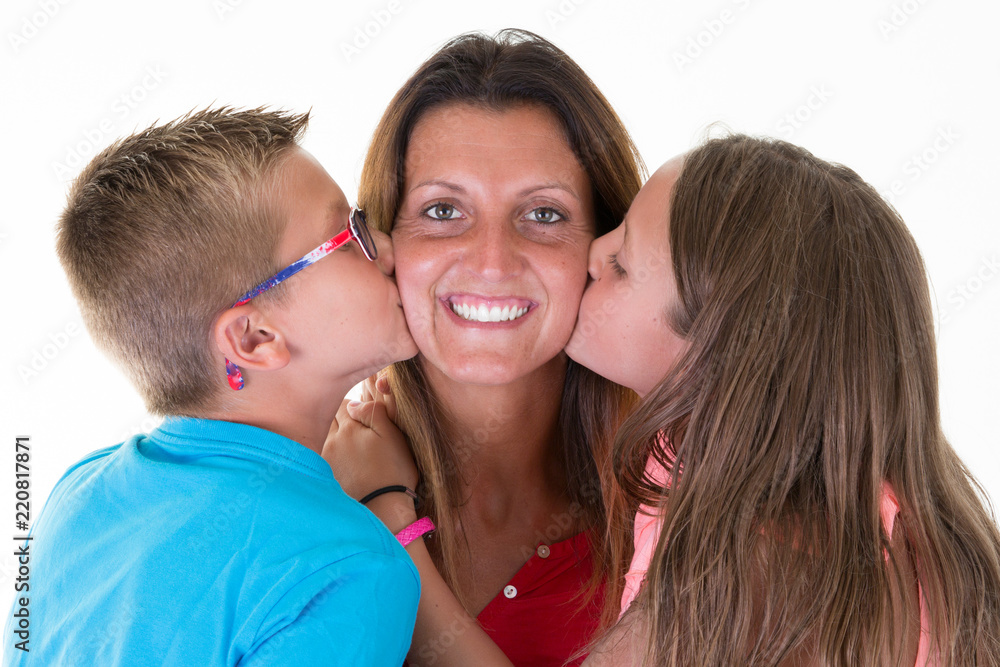 cheerful mother kiss by son daughter boy and girl children concept happy family love