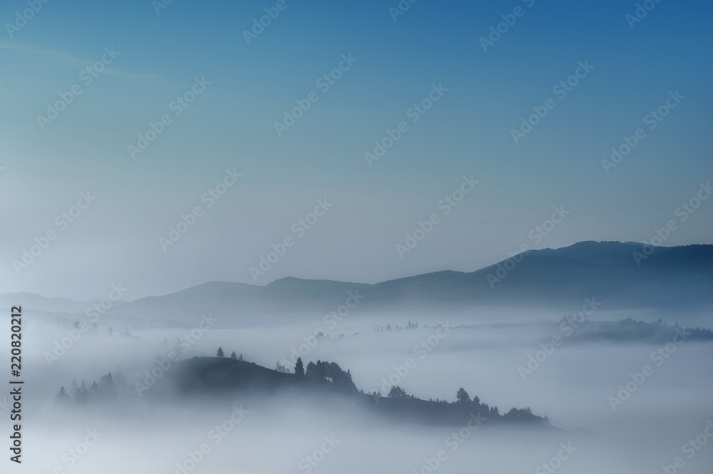 Fototapeta premium foggy morning in mountains. amazing fairy landscape