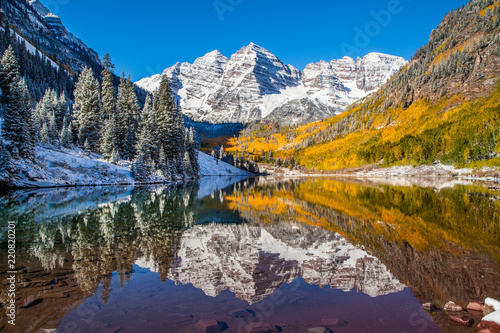 Maroon Bells in fall foliage after snow storm in Aspen,  Colorado photo