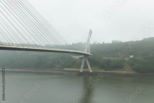 View of a cable-stayed bridge Pont de Terenez in France on a sunny summer morning photo